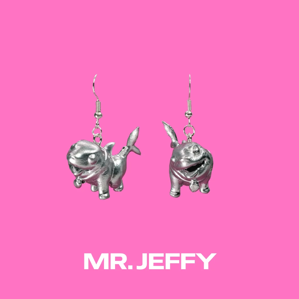 Mr Jeffy Silver earrings on a pink background