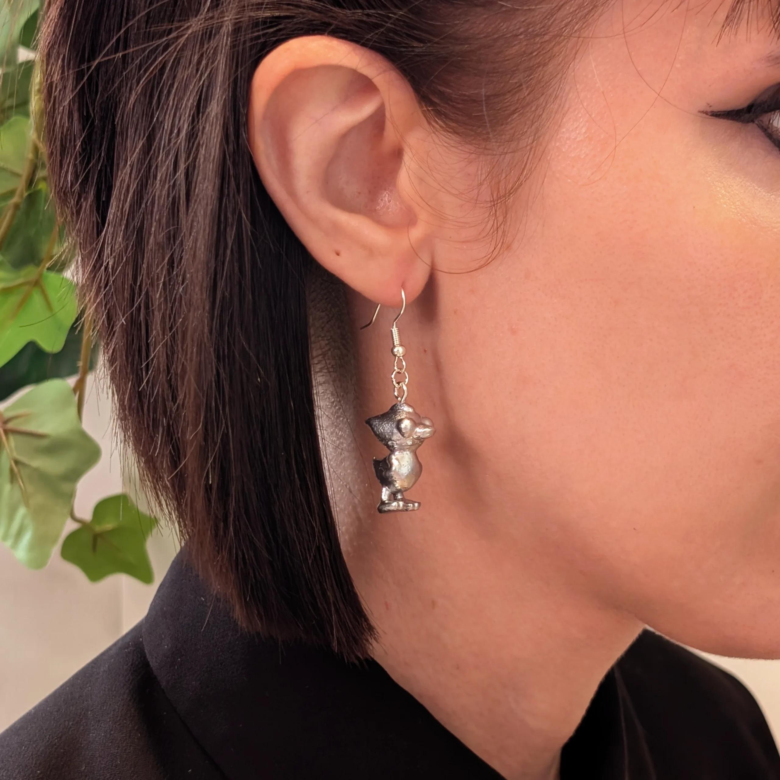 Tarquinn Duck silver earrings worn on a model