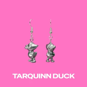 Tarquinn Duck silver earrings on a pink background