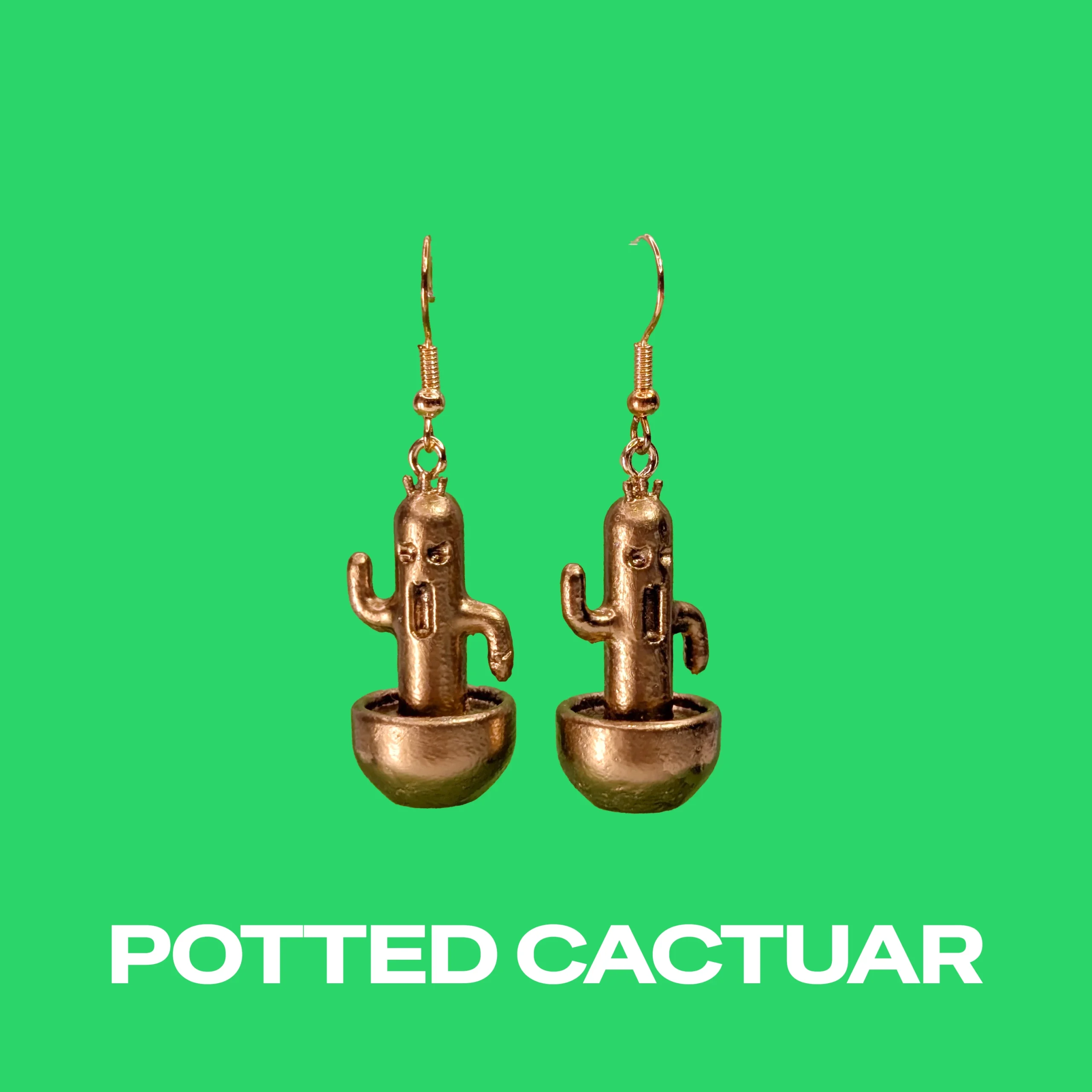 Cactuar Gold earrings on a green background