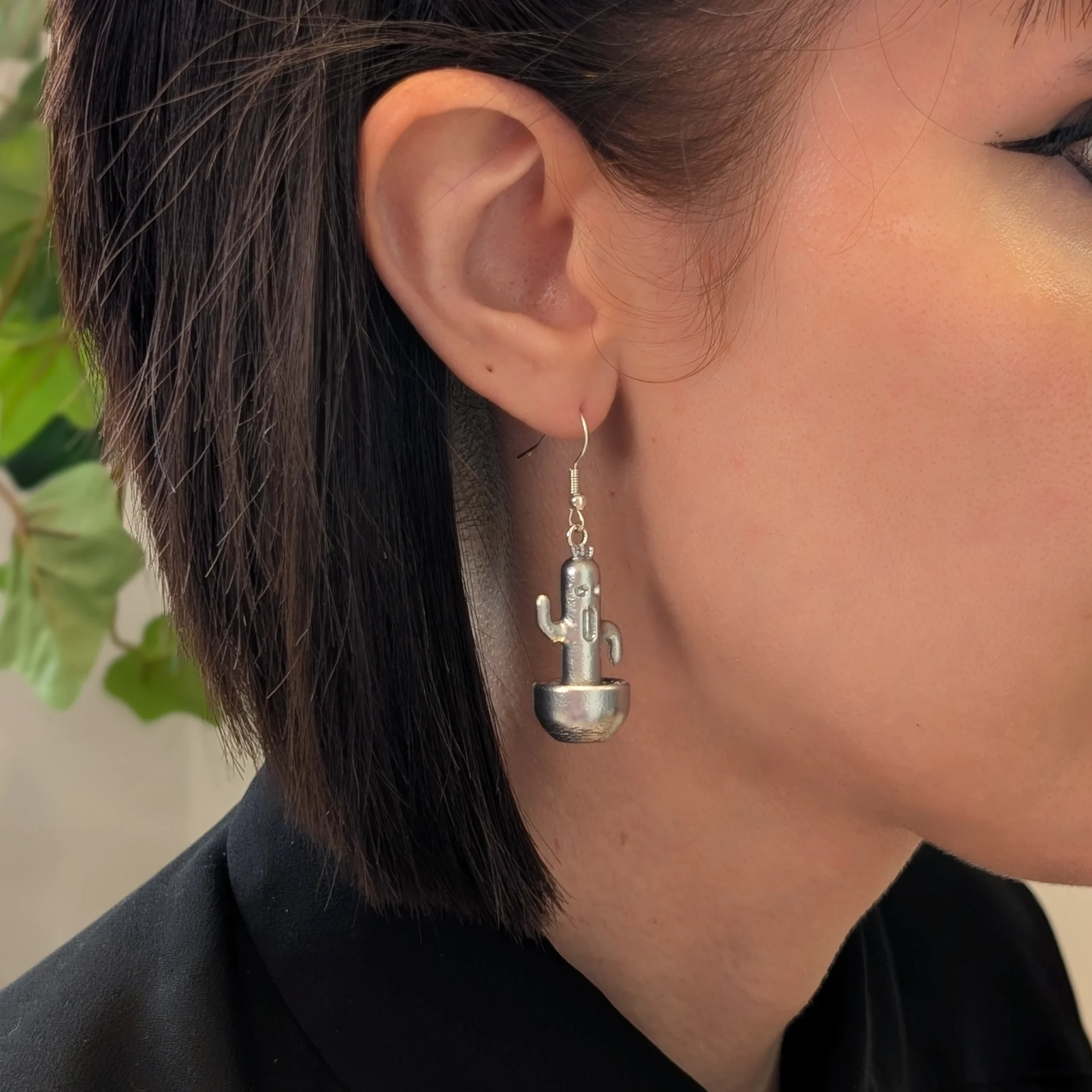 Cactuar Silver earrings worn on a model
