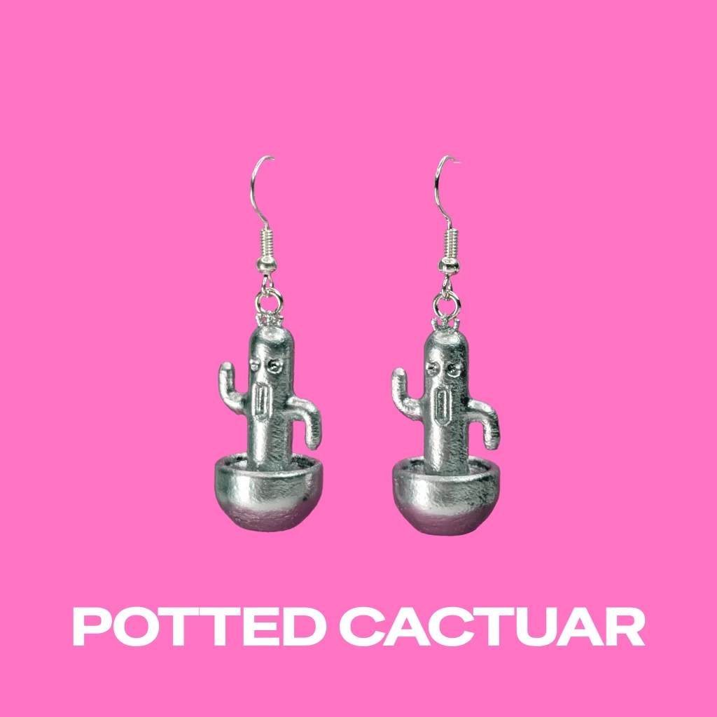 Cactuar Silver earrings on a pink background
