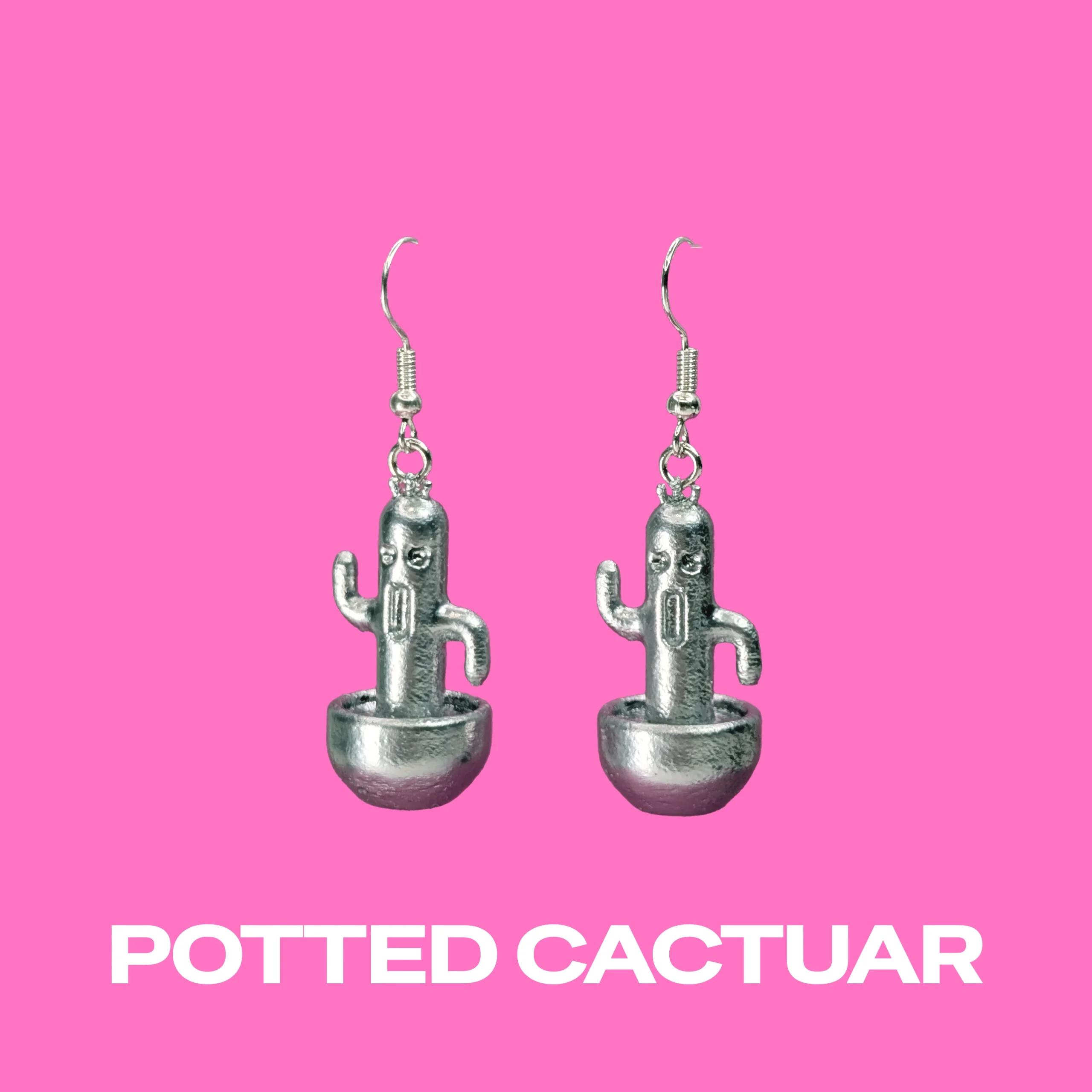 Cactuar Silver earrings on a pink background